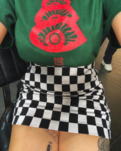 Load image into Gallery viewer, woman wearing green oversized stress tee with checkered skirt stress graphic closeup