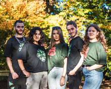 Load image into Gallery viewer, women and men wearing green oversized stress t-shirts and black oversized bubbles t-shirts